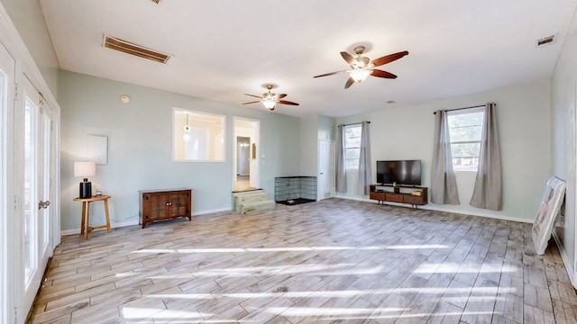 unfurnished living room with light hardwood / wood-style floors and ceiling fan