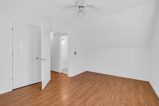 interior space with ceiling fan, light wood-type flooring, and lofted ceiling