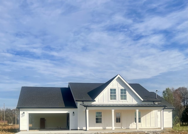 view of front of home featuring a garage and covered porch