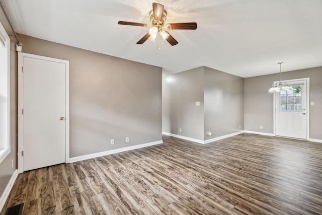 unfurnished room featuring ceiling fan and wood-type flooring