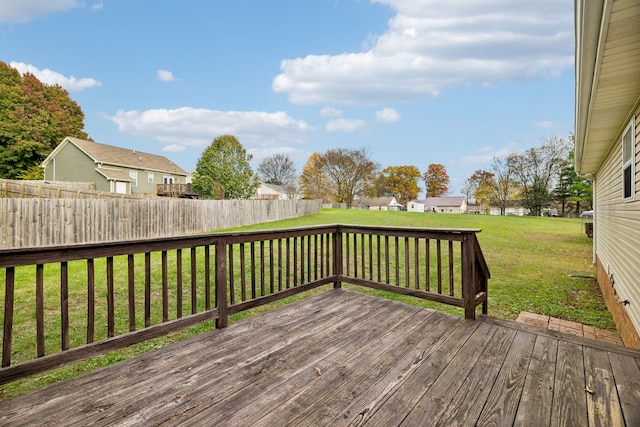 wooden terrace featuring a yard