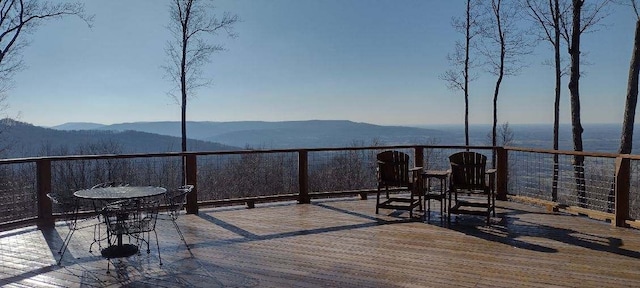 wooden terrace with a mountain view