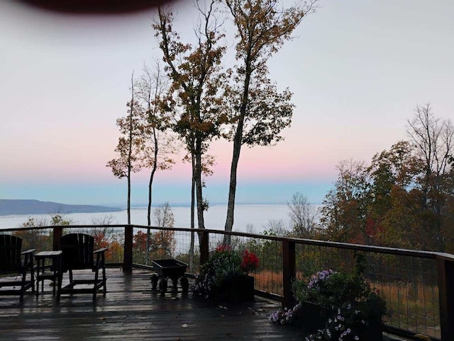 deck at dusk with a mountain view