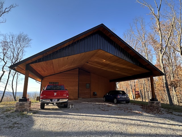 view of vehicle parking with a carport