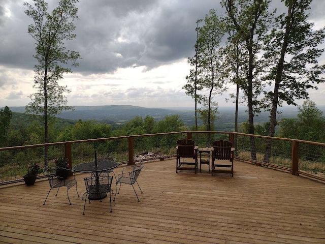 wooden terrace with a mountain view