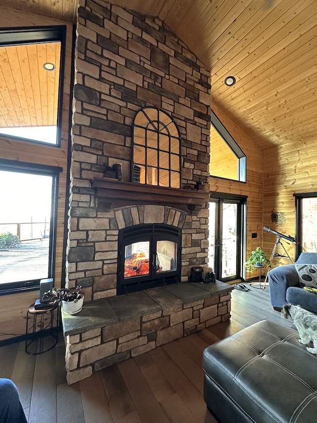 living room with a fireplace, wood-type flooring, high vaulted ceiling, and wood ceiling