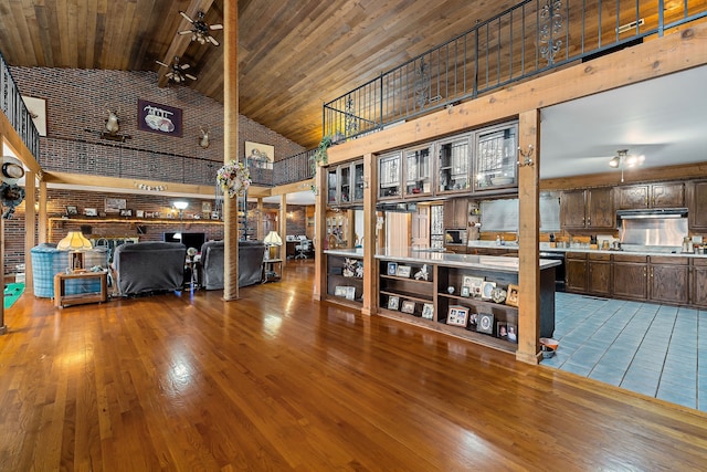 interior space featuring hardwood / wood-style floors, wooden ceiling, high vaulted ceiling, ceiling fan, and beam ceiling