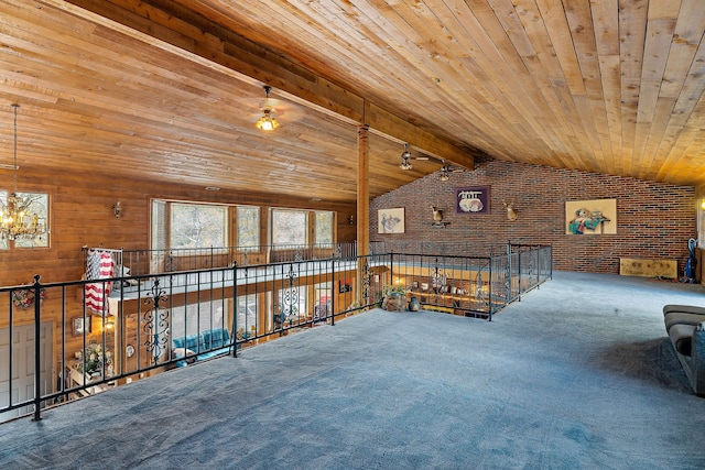 unfurnished room with carpet flooring, lofted ceiling with beams, and wood ceiling