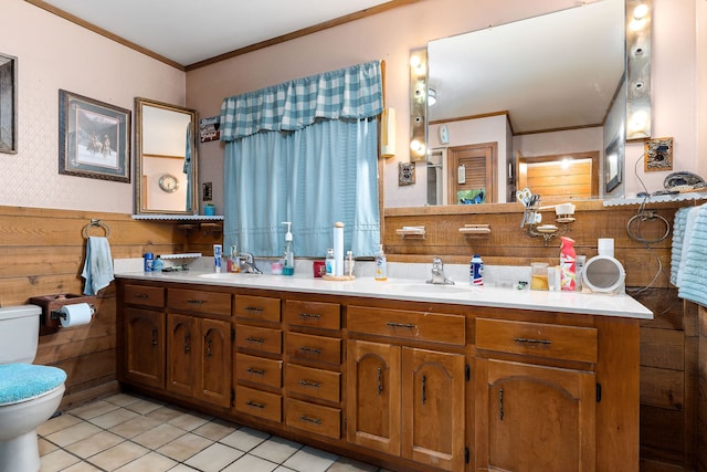 bathroom featuring toilet, vanity, tile patterned floors, and ornamental molding