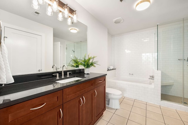 full bathroom with tile patterned flooring, vanity, toilet, and separate shower and tub