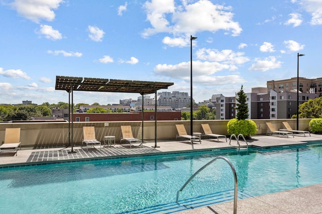 view of swimming pool featuring a pergola and a patio area