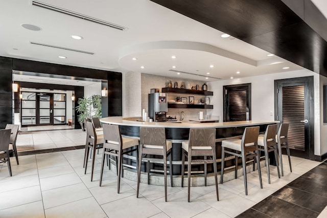 bar with light tile patterned flooring and sink