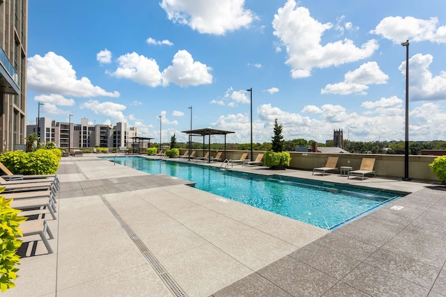 view of swimming pool featuring a patio