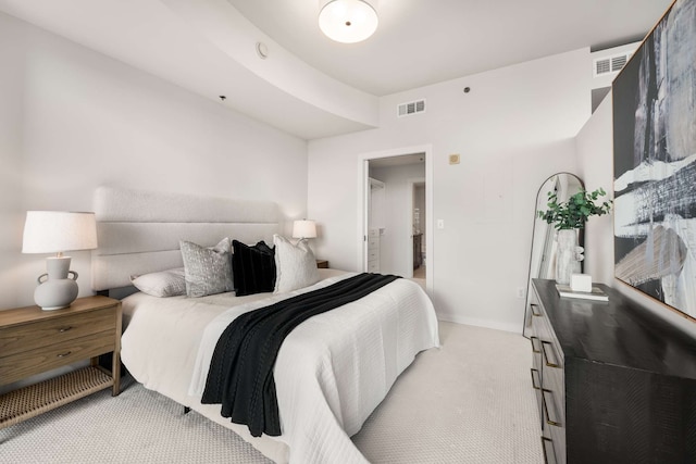 bedroom featuring light carpet