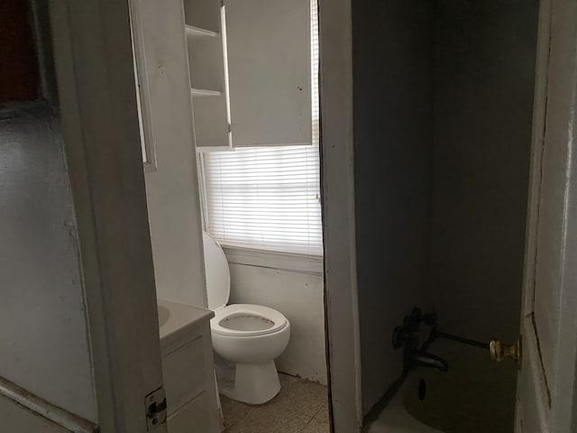 full bathroom featuring tile patterned flooring, vanity, tub / shower combination, and toilet