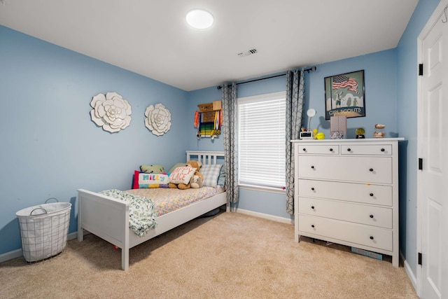 bedroom with light colored carpet