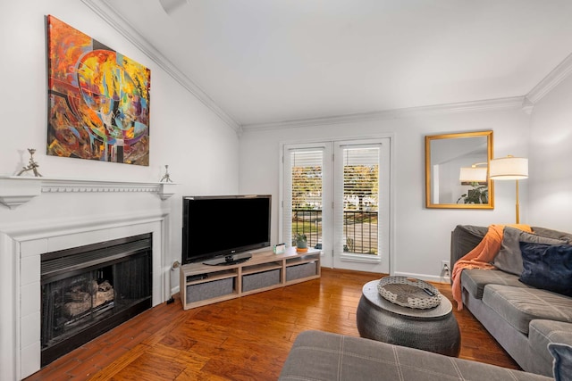 living room featuring hardwood / wood-style flooring and crown molding