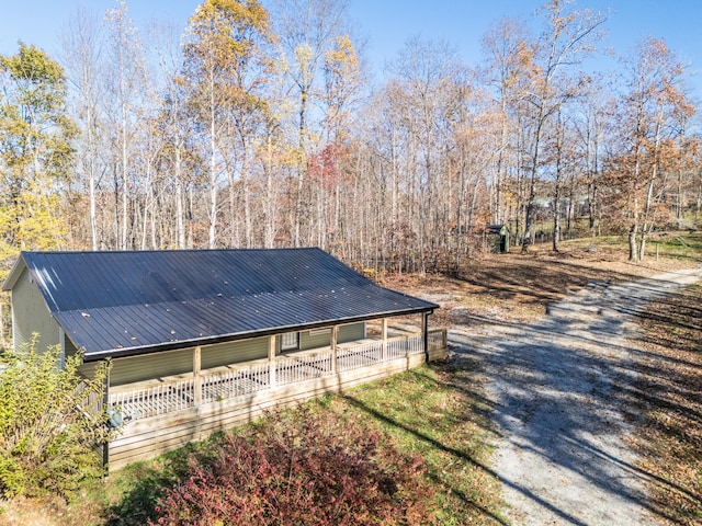 view of property exterior featuring covered porch