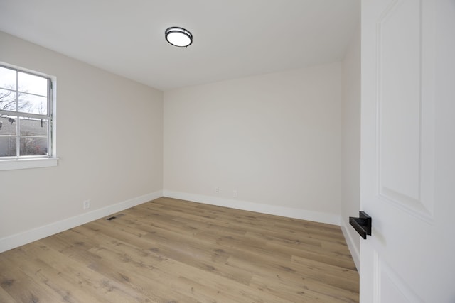 unfurnished room featuring light hardwood / wood-style floors