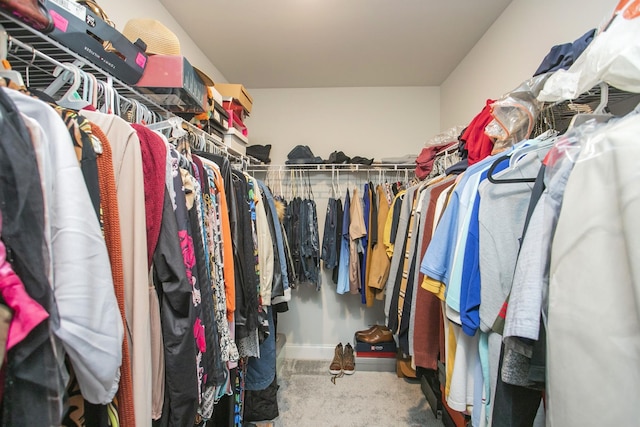 spacious closet with carpet floors