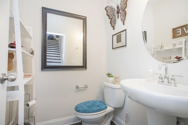 bathroom featuring toilet and sink