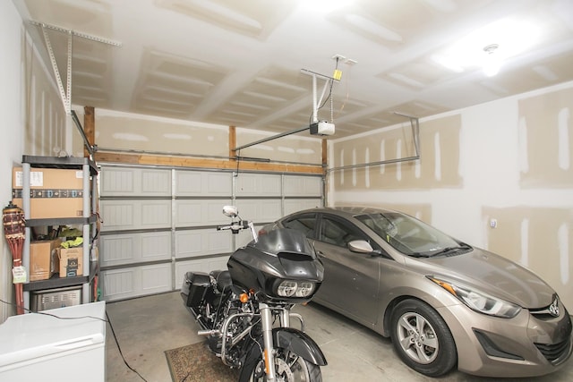 garage featuring a garage door opener