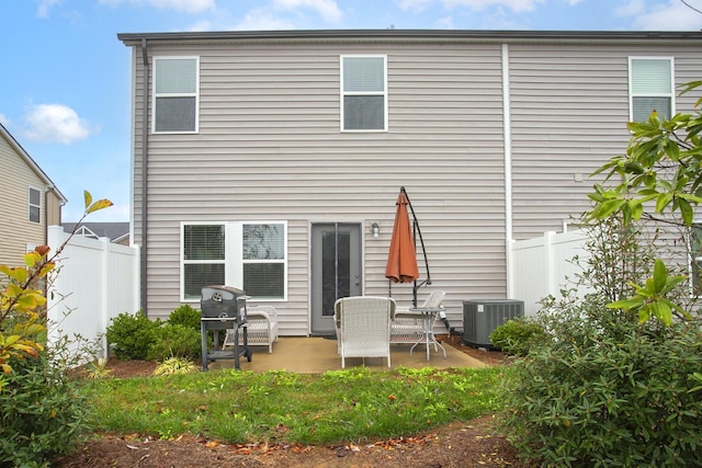 rear view of property featuring central AC and a patio