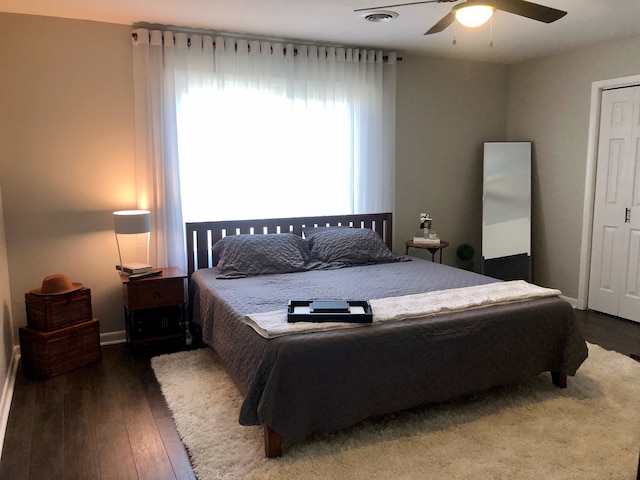 bedroom with hardwood / wood-style floors and ceiling fan