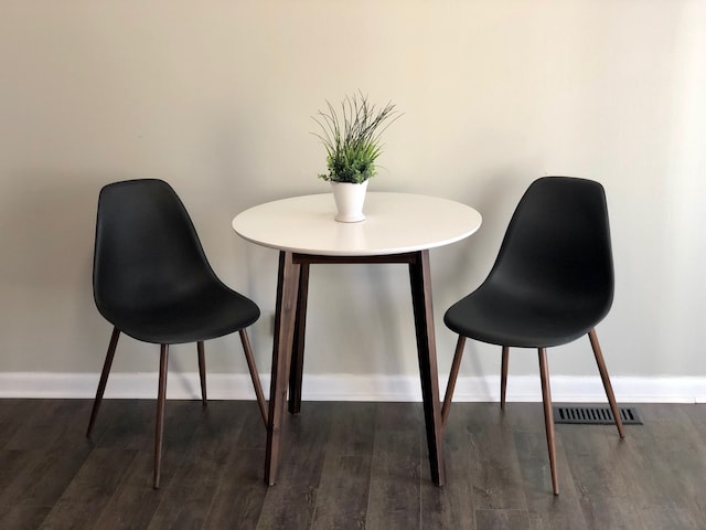 dining space with dark hardwood / wood-style floors