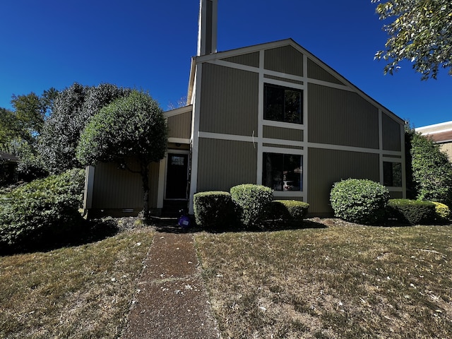 view of home's exterior featuring a yard