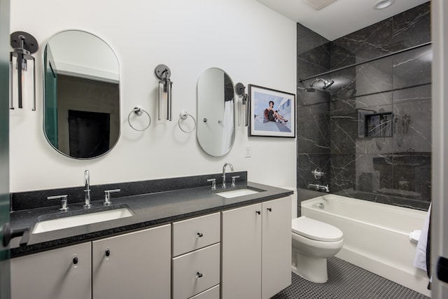 full bathroom with tile patterned flooring, vanity, toilet, and tiled shower / bath