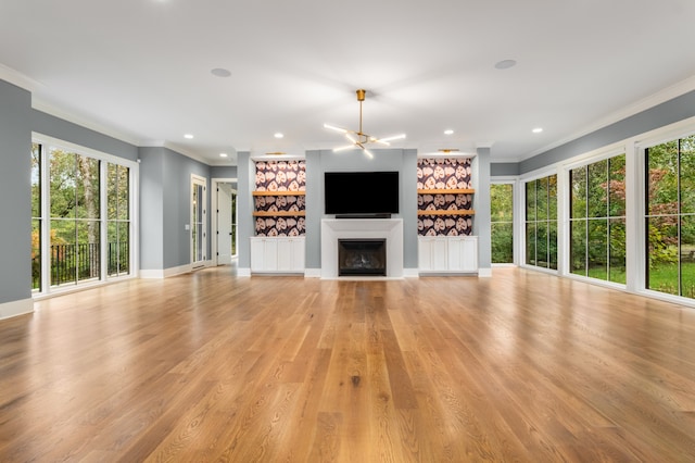 unfurnished living room featuring light wood-type flooring and crown molding