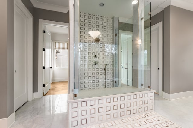 bathroom featuring a shower with shower door and crown molding