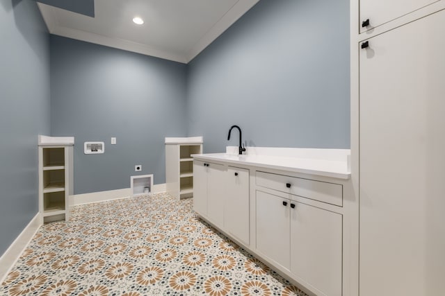 laundry room featuring cabinets, sink, crown molding, hookup for a washing machine, and hookup for an electric dryer