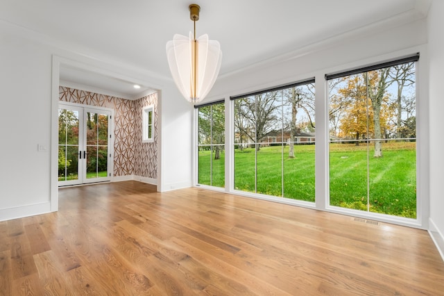 unfurnished sunroom with french doors