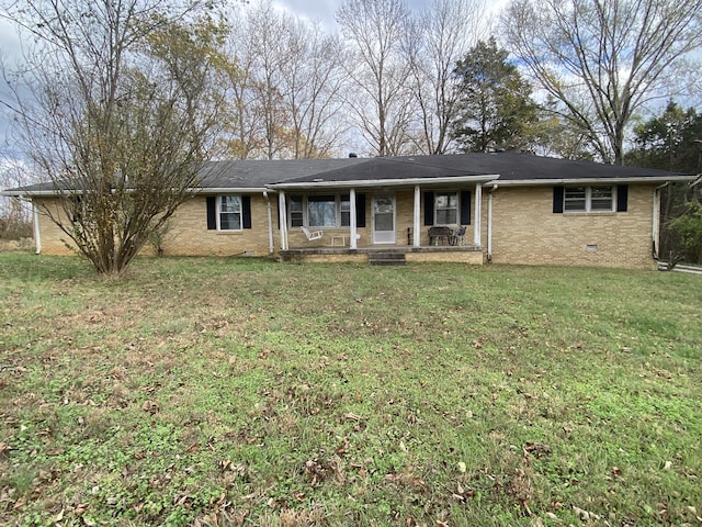 single story home with covered porch and a front lawn