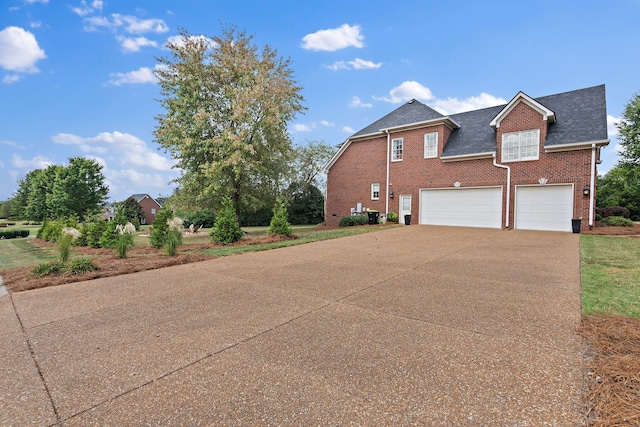 view of side of property with a garage