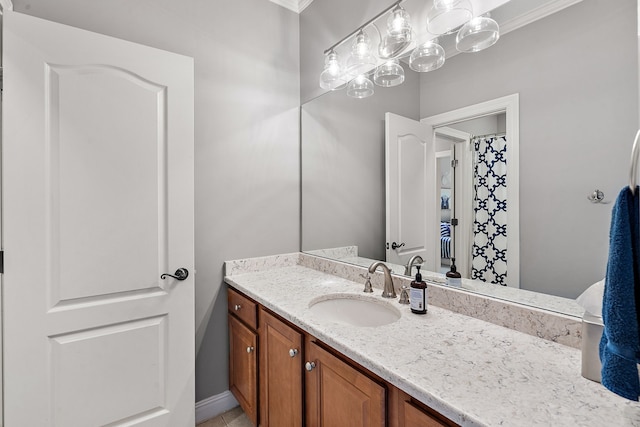 bathroom with vanity and crown molding