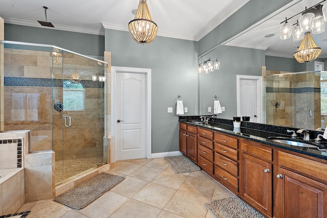 bathroom with tile patterned flooring, vanity, ornamental molding, and walk in shower