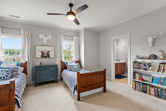 bedroom with connected bathroom, ceiling fan, light colored carpet, and ornamental molding