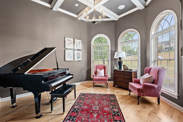 sitting room featuring crown molding, beamed ceiling, light hardwood / wood-style floors, and coffered ceiling