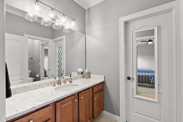 bathroom featuring vanity, ceiling fan, toilet, and crown molding