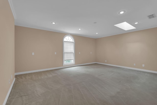 1406 Ottawa Pl, Murfreesboro, TN 37129 - unfurnished room with a skylight, light colored carpet, recessed lighting, baseboards, and crown molding