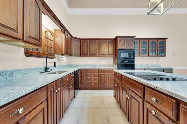 1406 Ottawa Pl, Murfreesboro, TN 37129 - kitchen with black appliances, a sink, ornamental molding, light stone counters, and glass insert cabinets
