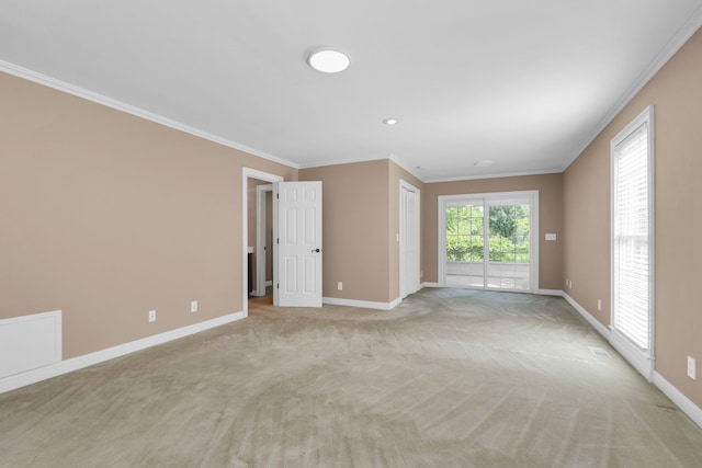 carpeted empty room with ornamental molding