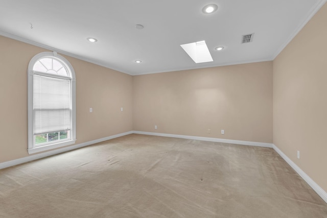 1406 Ottawa Pl, Murfreesboro, TN 37129 - spare room featuring crown molding, a skylight, light colored carpet, baseboards, and plenty of natural light