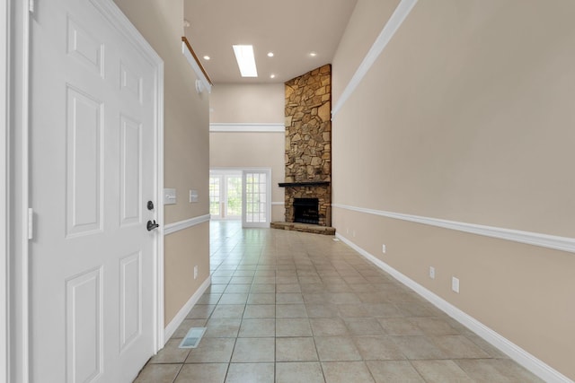 1406 Ottawa Pl, Murfreesboro, TN 37129 - unfurnished living room with a skylight, a fireplace, light tile patterned flooring, recessed lighting, and baseboards