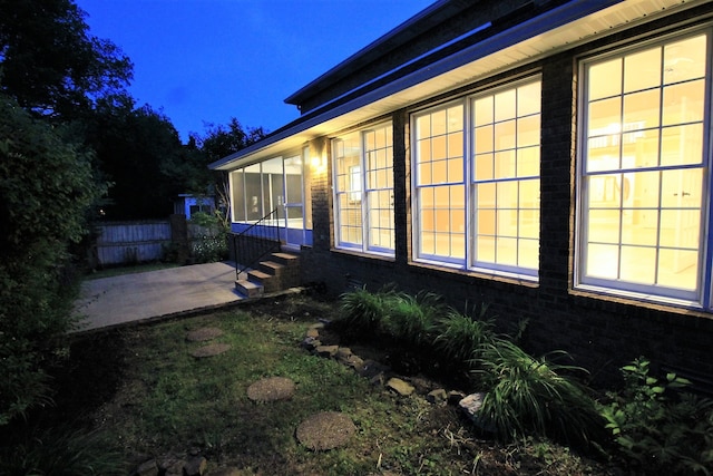 view of property exterior with a patio