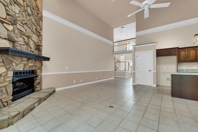 1406 Ottawa Pl, Murfreesboro, TN 37129 - unfurnished living room with a high ceiling, a ceiling fan, light tile patterned floors, baseboards, and a fireplace