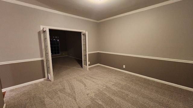 spare room with carpet and crown molding